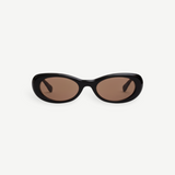 KABE SHOP INC Naomi sunglasses featuring an exaggerated black oval cellulose acetate frame and tinted lenses.