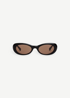 KABE SHOP INC Naomi sunglasses featuring an exaggerated black oval cellulose acetate frame and tinted lenses.