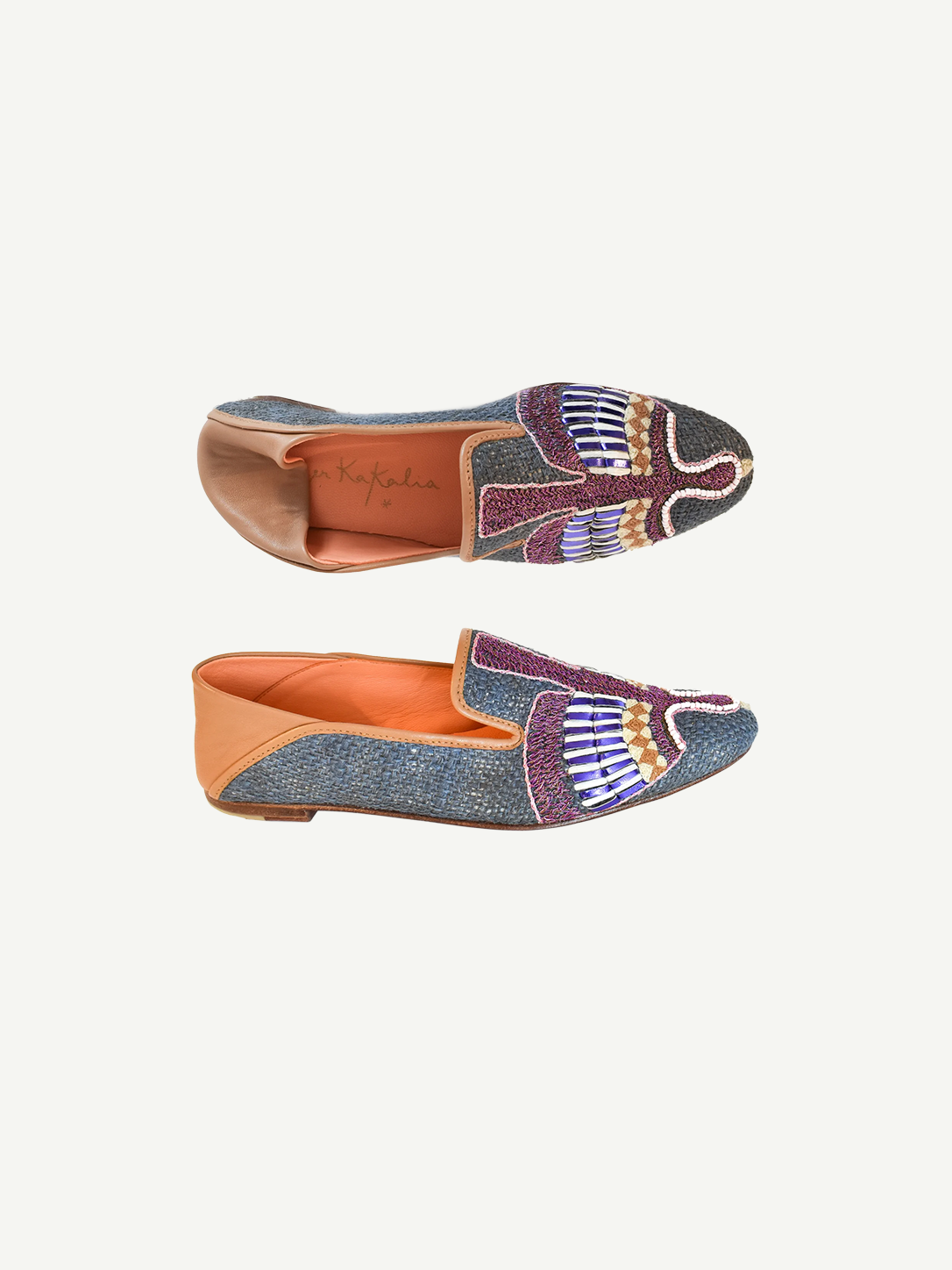 Two Anzu Moccasins featuring colorful, intricate beadwork and tan leather accents are displayed against a white background—one viewed from the top and one from the side. These hand-embroidered leather moccasins highlight vibrant craftsmanship and timeless style.