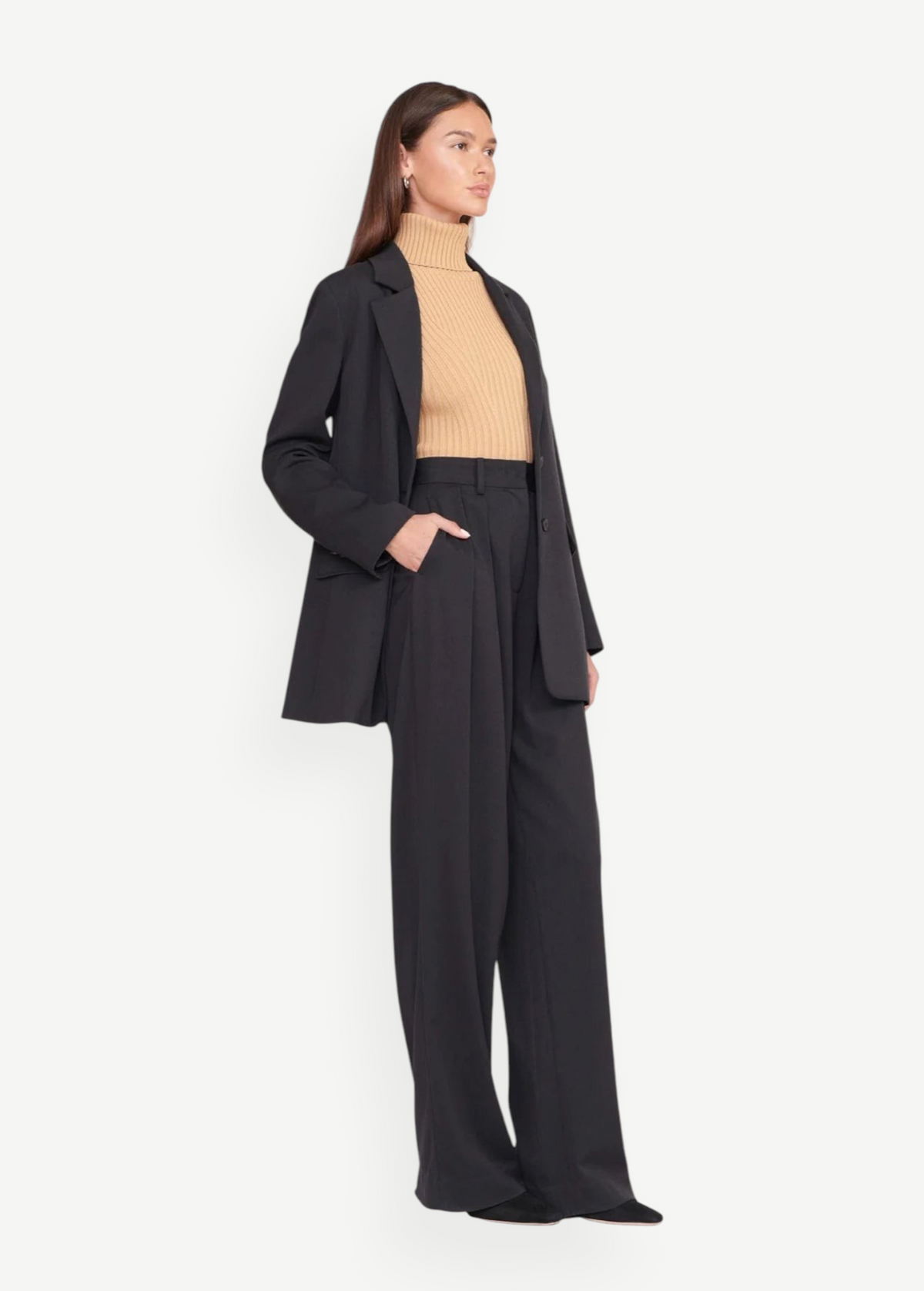 Model wearing KABE SHOP INC Luisa Pant in black with a matching blazer and beige turtleneck for a polished look.