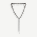 The Lariat Necklace White Bronze is a V-shaped lariat necklace in a sleek silver tone, featuring an adjustable length and long cascading chains draping from the center like a metallic ribbon, shown against a plain white background.