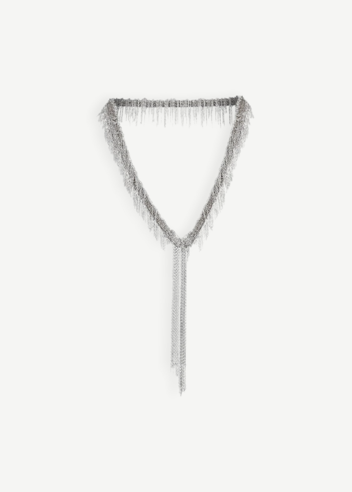 The Lariat Necklace White Bronze is a V-shaped lariat necklace in a sleek silver tone, featuring an adjustable length and long cascading chains draping from the center like a metallic ribbon, shown against a plain white background.