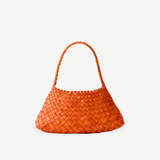 KABE SHOP INC Rosanna Bag in burnt orange handwoven buffalo leather with a sleek shoulder silhouette.