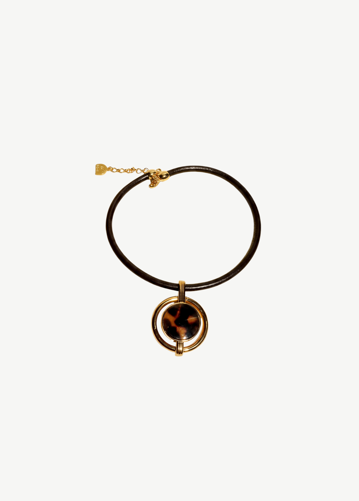 KABE SHOP INC oval pendant necklace featuring a gold-plated frame with a tortoiseshell inlay on a brown cord.