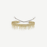 A gold beaded choker necklace with fringed dangling strands, tied at the back with adjustable silver cords, is beautifully displayed against a plain white background—an ideal match for the N° 675 Gold Bracelet, creating an elegant layered look.