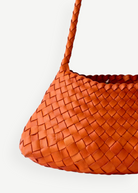 KABE SHOP INC Rosanna Bag in vibrant orange handwoven buffalo leather with a sleek shoulder strap design.