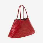 A large red Santa Croce Big Bag, crafted from woven leather with two handles, is displayed against a plain light gray background.