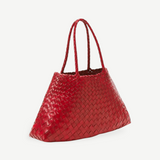 A large red Santa Croce Big Bag, crafted from woven leather with two handles, is displayed against a plain light gray background.
