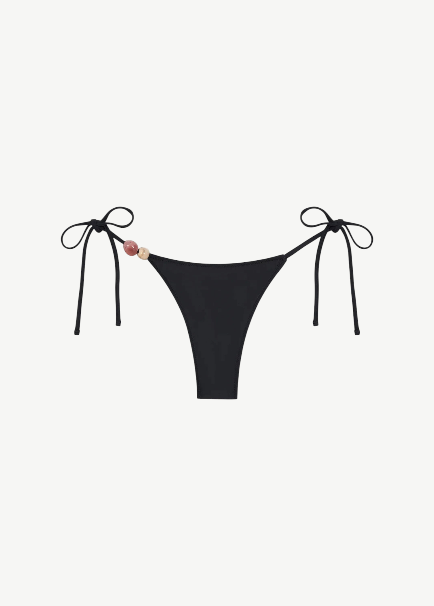 Introducing the Praia Bottom: a black bikini bottom featuring adjustable side ties and two decorative beads—one pink and one beige—on the left. Crafted from recycled polyamide, this minimal, sleek tie-bottom belongs to our eco-friendly swimwear collection, making it an ideal choice for stylish swimmers seeking sustainability.