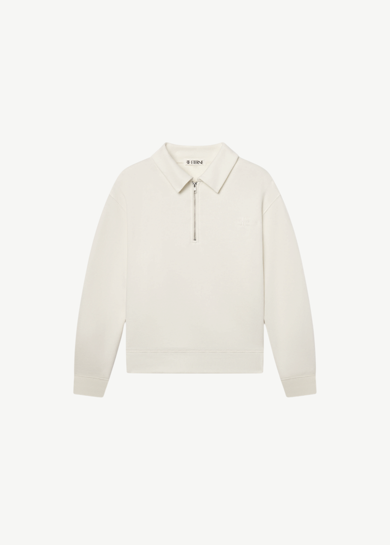 KABE SHOP INC oversized cream French terry polo sweatshirt with a half-zip front and collared neckline.
