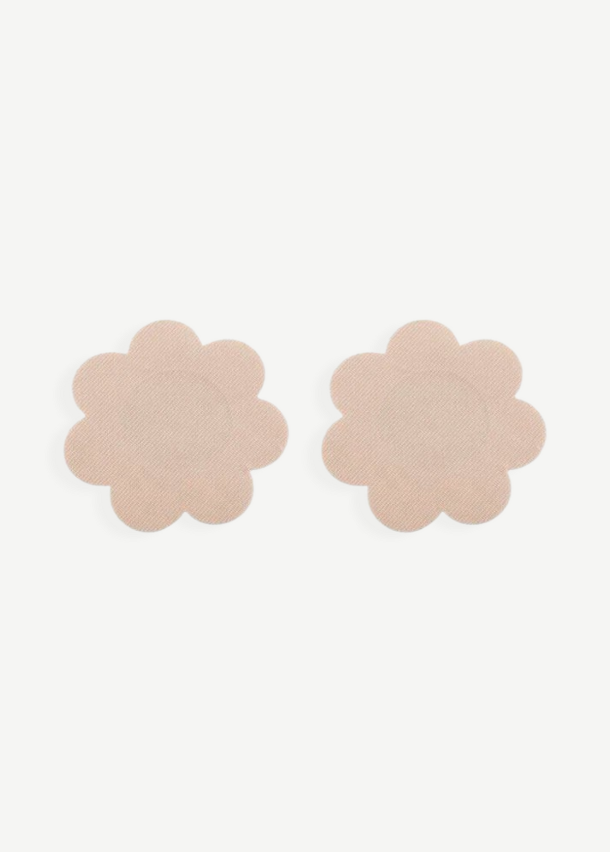 KABE SHOP INC Nippz disposable flower-shaped adhesive nipple covers in a discreet nude tone for smooth coverage.