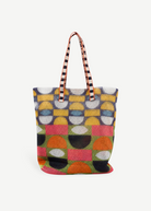 KABE SHOP INC Kanpur tote bag featuring a vibrant geometric pattern in yellow, orange, green, and black mesh fabric.