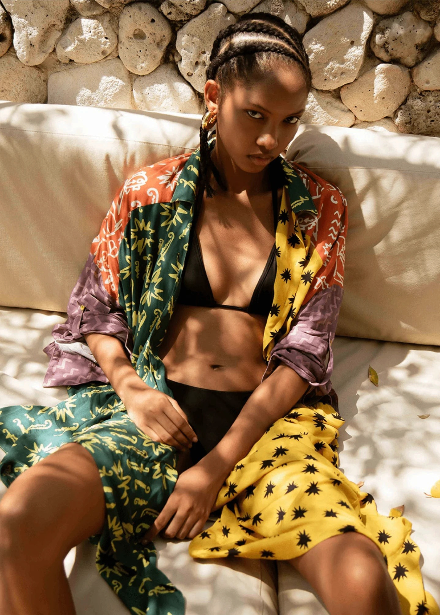 Model wearing KABE SHOP INC Estrellitas viscose shirt dress with colorful star print, wrap design, and long sleeves.