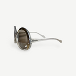 KABE SHOP INC Neostyle sunglasses featuring oversized round frames in a translucent clear finish with brown lenses.