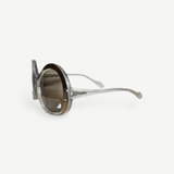 KABE SHOP INC Neostyle sunglasses featuring oversized round frames in a translucent clear finish with brown lenses.