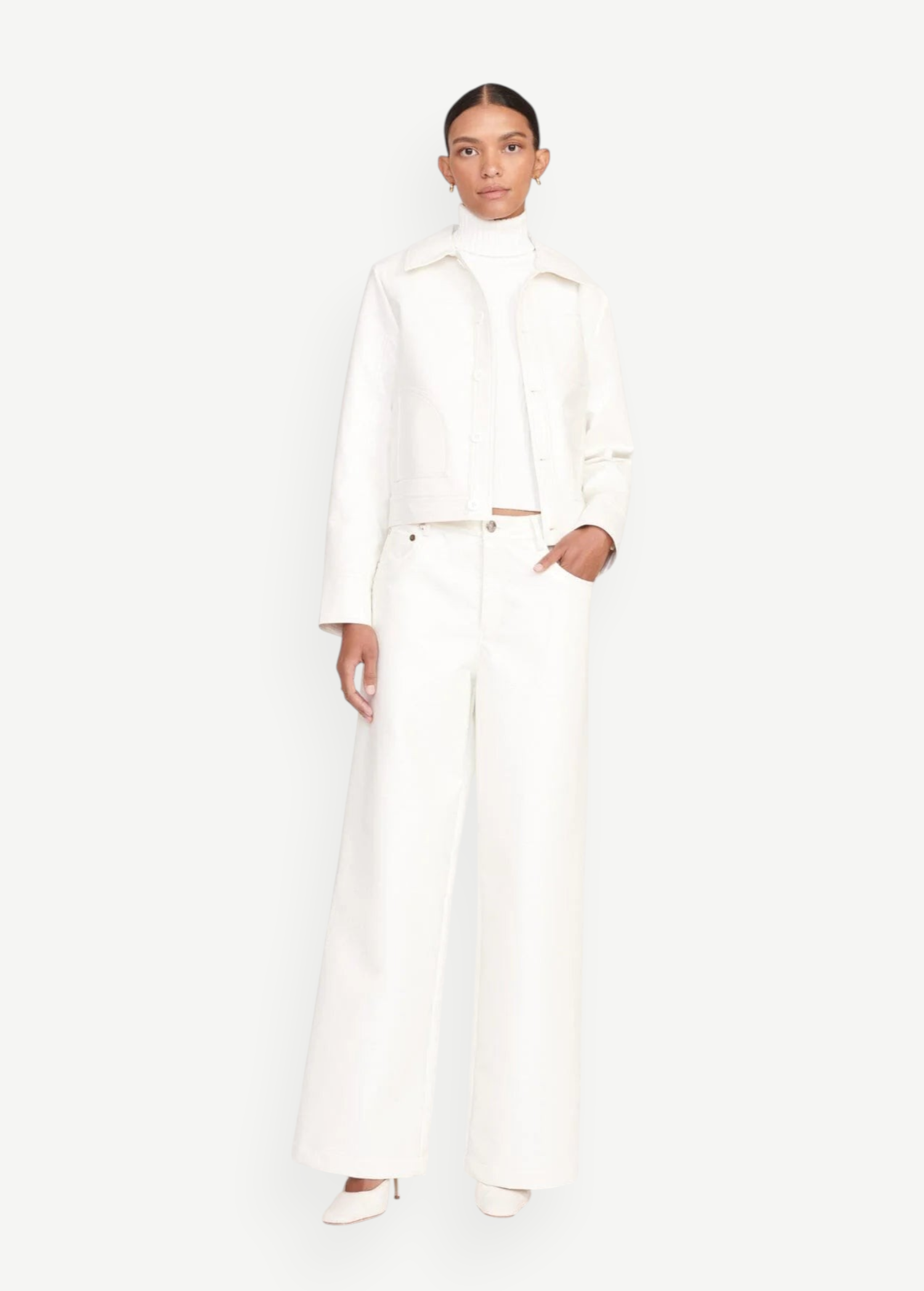 Model wearing KABE SHOP INC Grayson wide-leg white pants with a matching white jacket and turtleneck