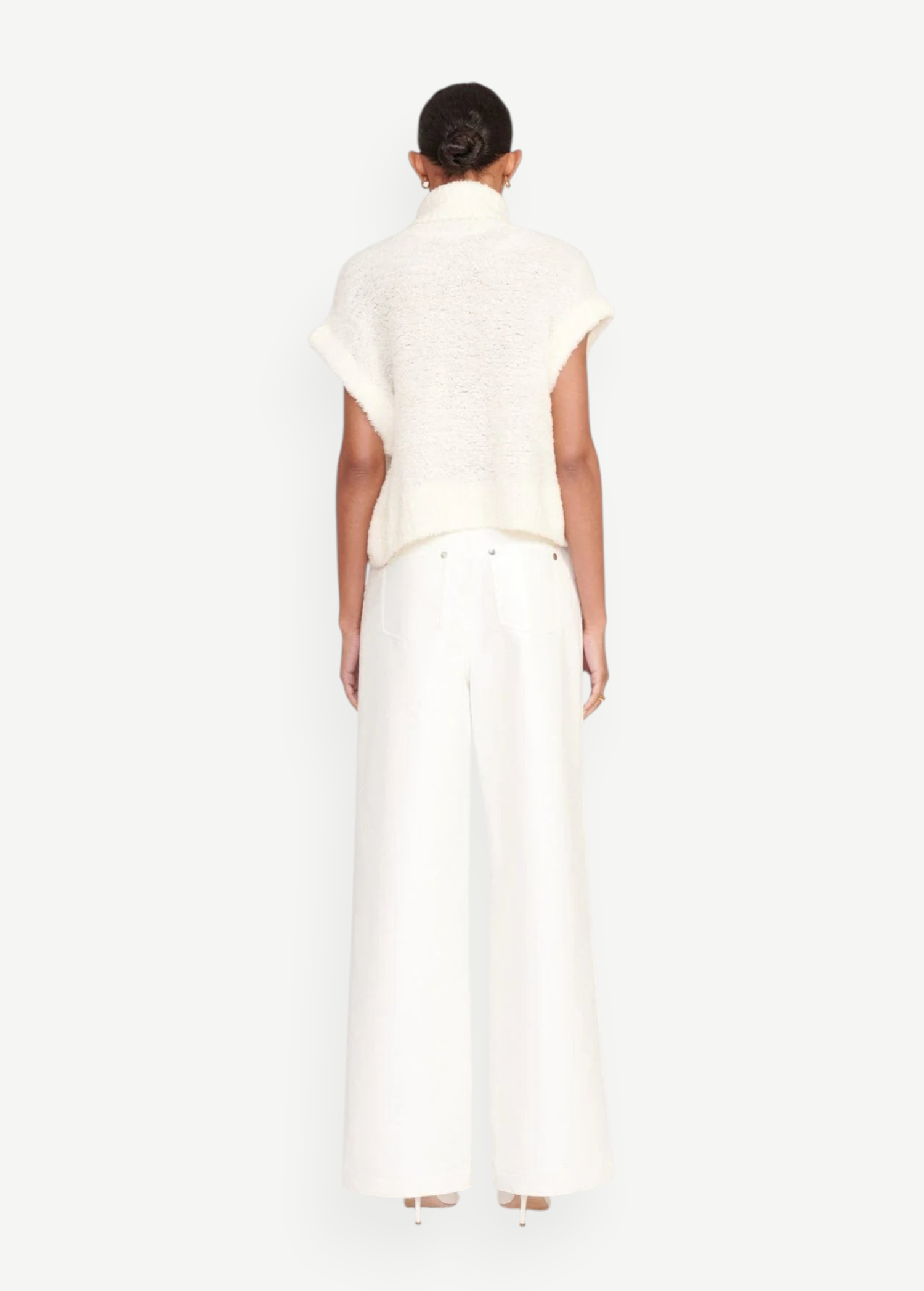Back view of a model wearing KABE SHOP INC white wide-leg Grayson pants paired with a cream textured knit top