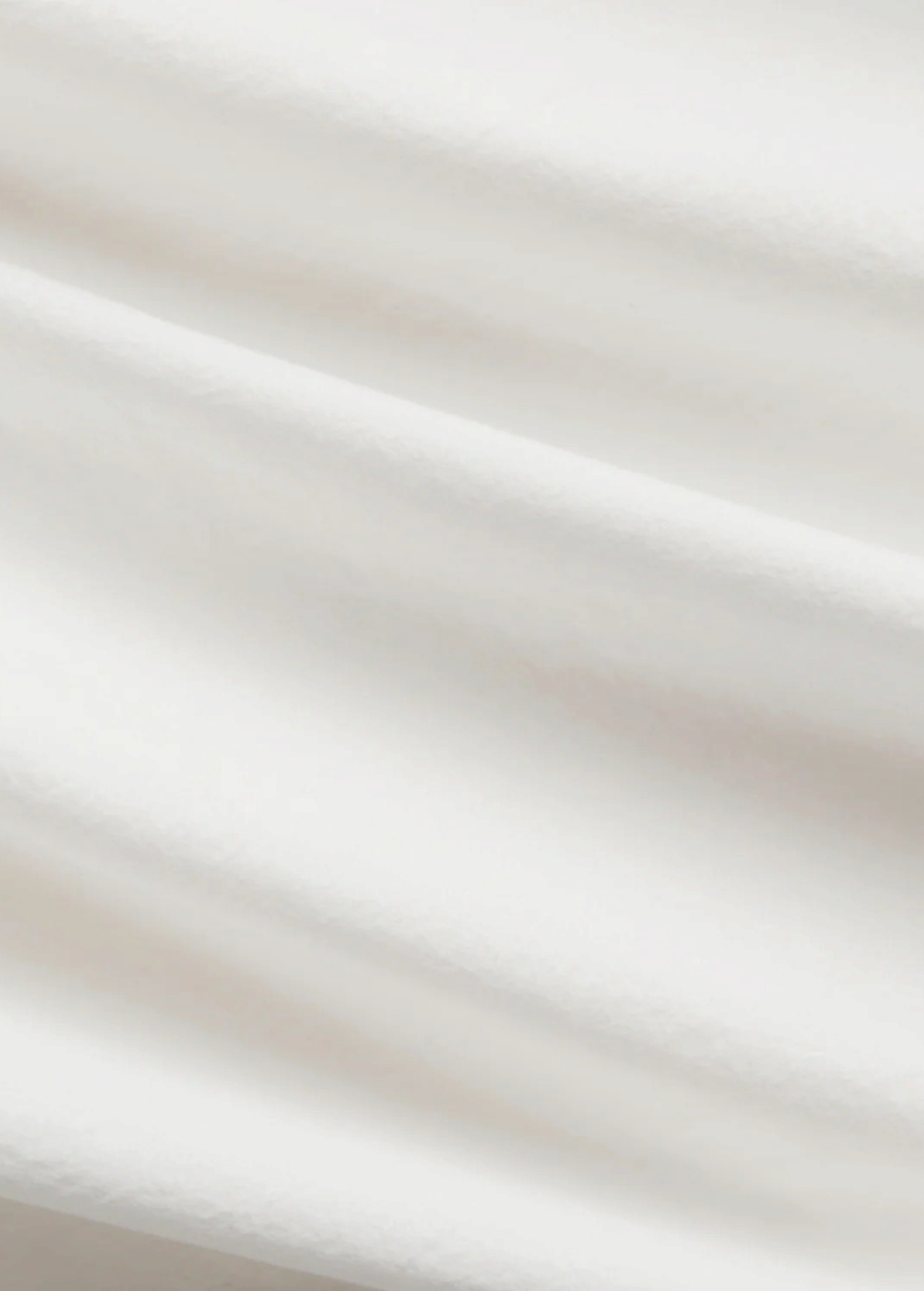 Close-up of the white lightweight cotton fabric of the KABE SHOP INC Kyoto wide leg pant showing soft folds