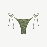 Praia Bottom in olive green with a sparkling sequin overlay and adjustable side ties, displayed on a white background.