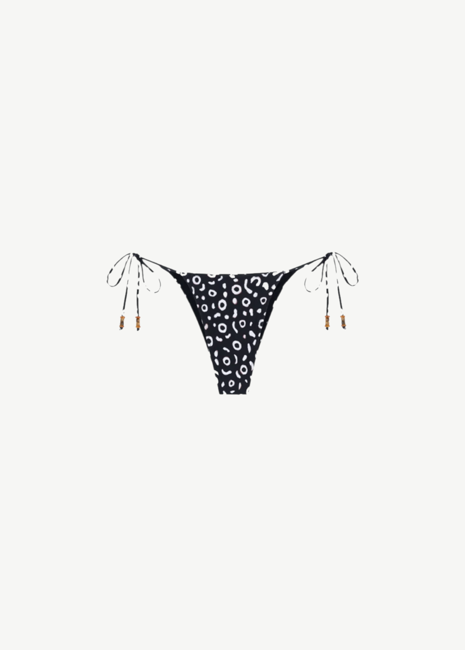 KABE SHOP INC Minerva bikini bottom in black and white abstract print with side tie strings and wooden bead accents.