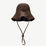 KABE SHOP INC brown woven straw hat bag with a wide brim and adjustable chin strap in a contemporary design