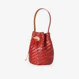 KABE SHOP INC Nirmala bucket bag in red woven leather with a sculptural stone toggle closure and slim handle.