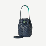 KABE SHOP INC Nirmala Intreccio bucket bag in woven navy leather with a green stone clasp and teal interior lining