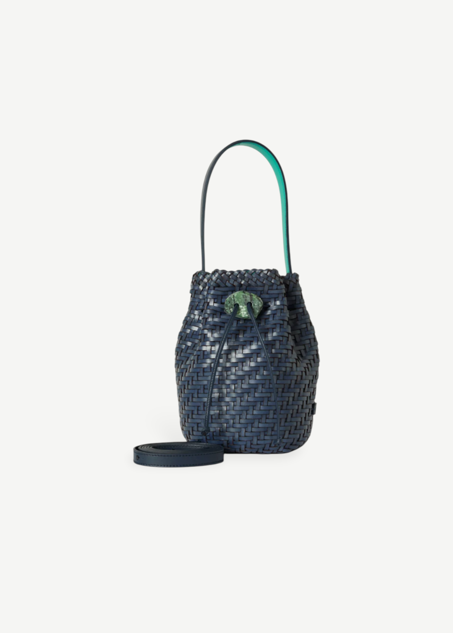 KABE SHOP INC Nirmala Intreccio bucket bag in woven navy leather with a green stone clasp and teal interior lining