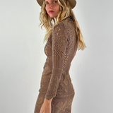 Model wearing a KABE SHOP INC long-sleeve brown crochet mini dress and a matching fedora hat against a white background