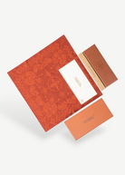 KABE SHOP INC Annie-O rose gold glasses packaging with a patterned red cloth, branded box, and warranty card.