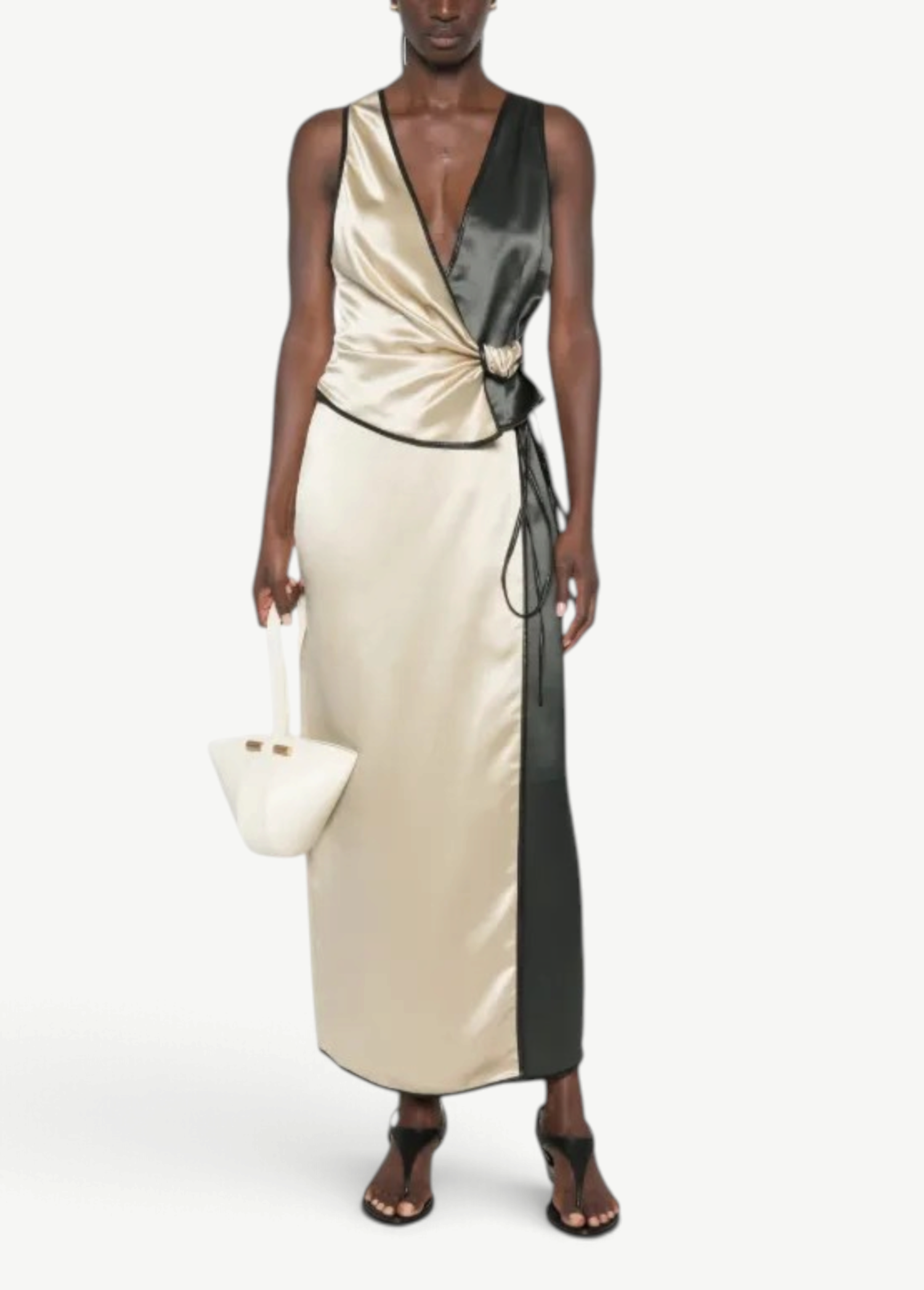 Model wearing KABE SHOP INC Aisling top in champagne and black satin with a wrap-style silhouette and contrast trim.