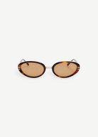KABE Ambra oval sunglasses featuring a tortoiseshell frame and gradient brown lenses with gold-tone details.