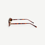 KABE Ambra oval sunglasses with a tortoiseshell frame, slim temples, and gold-tone logo lettering side view