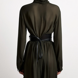 KABE SHOP INC Undone Corset Belt in black calfskin worn over a dark green dress, showing back view and tie detail.