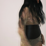 KABE SHOP INC Undone Corset Belt in black calfskin worn over a shimmering metallic mesh dress for a sculpted waist.