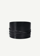 KABE SHOP INC black calfskin Undone Corset Belt featuring a wide, sculpted design with wrap-around leather straps.