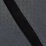 Close-up of black 100% silk fabric texture from the KABE SHOP INC Nori Mini Dress showing fine weave and seam detail.
