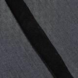 Close-up of black 100% silk fabric texture from the KABE SHOP INC Nori Mini Dress showing fine weave and seam detail.