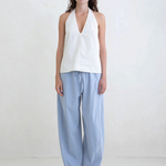 Model wearing KABE SHOP INC Breezy Pant in light blue with a relaxed straight-leg fit and adjustable waist