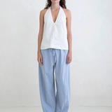 Model wearing KABE SHOP INC Breezy Pant in light blue with a relaxed straight-leg fit and adjustable waist