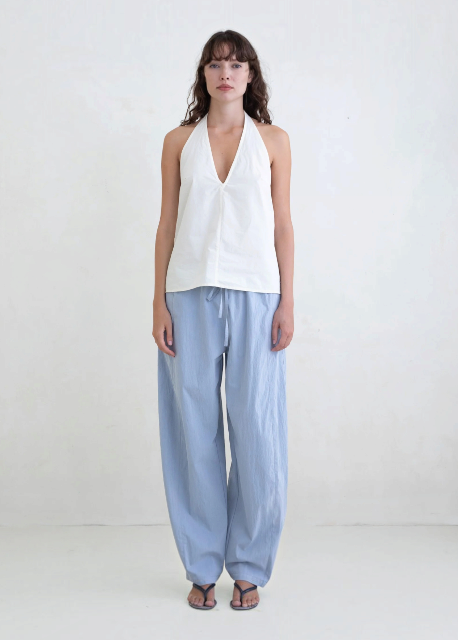 Model wearing KABE SHOP INC Breezy Pant in light blue with a relaxed straight-leg fit and adjustable waist