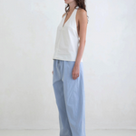 Model wearing KABE SHOP INC Breezy Pant in light blue with a straight-leg relaxed fit and adjustable waist.