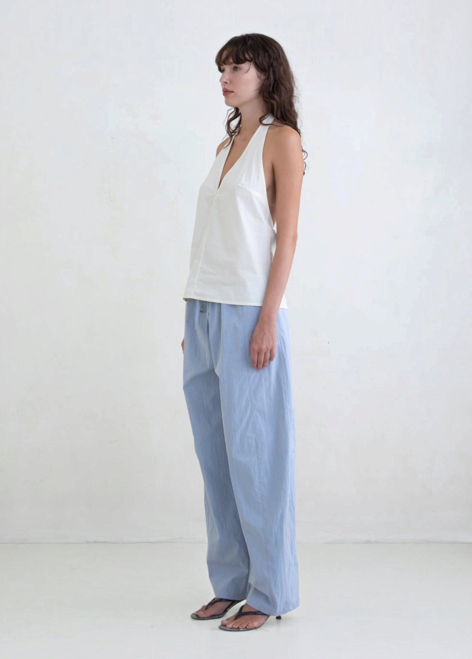 Model wearing KABE SHOP INC Breezy Pant in light blue with a straight-leg relaxed fit and adjustable waist.