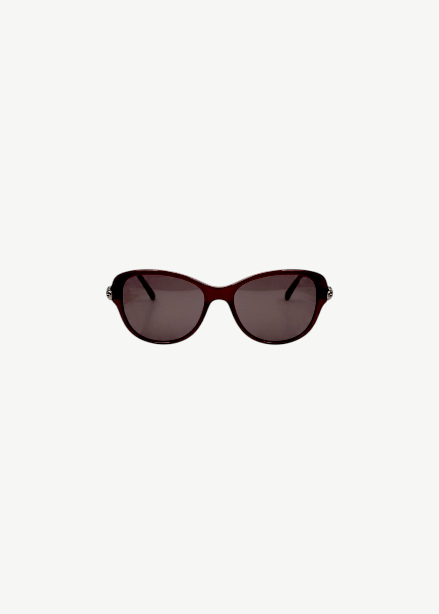 KABE SHOP INC Cartier sunglasses with a dark red oval frame and silver metal accents on the temples.