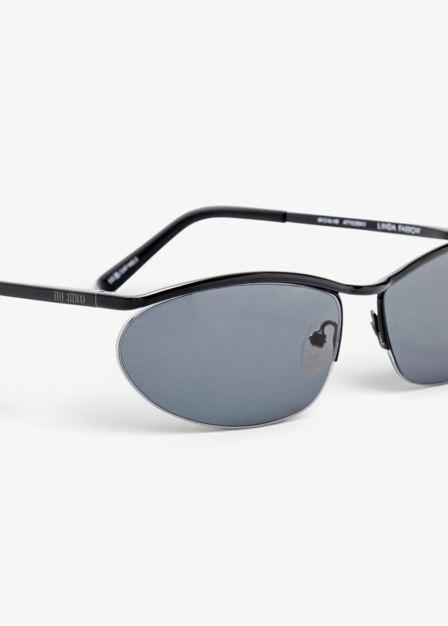 KABE SHOP INC Charlotte sunglasses featuring a sleek black metal oval frame and dark blue lenses with logo detailing.