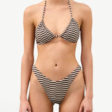 KABE SHOP INC Cocoa Grid halter bikini top and matching high-cut bottoms with a brown and white checkered pattern.
