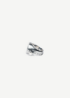 KABE SHOP INC Cricket ring in textured sterling silver with a rustic finish and small circular accents