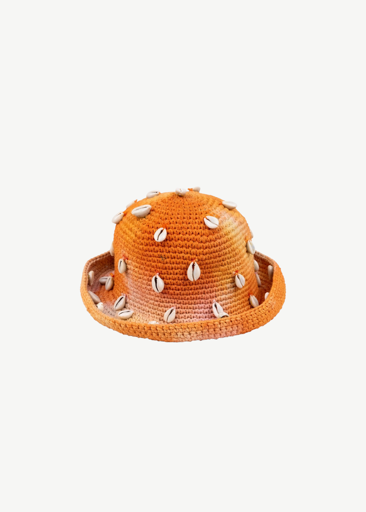 KABE SHOP INC handmade crochet bucket hat in orange tie-dye with decorative white cowrie shells