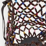 KABE SHOP INC Del Mar bucket bag featuring a brown wooden bead lattice design with colorful accents and a round base