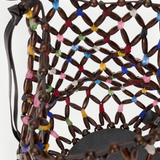 KABE SHOP INC Del Mar bucket bag featuring a brown wooden bead lattice design with colorful accents and a round base